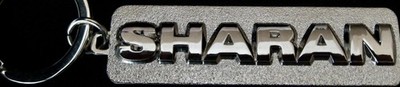 ''SHARAN KEY TAG DONE IN RAISED LETTERING AND SILVER TONE FINISH''