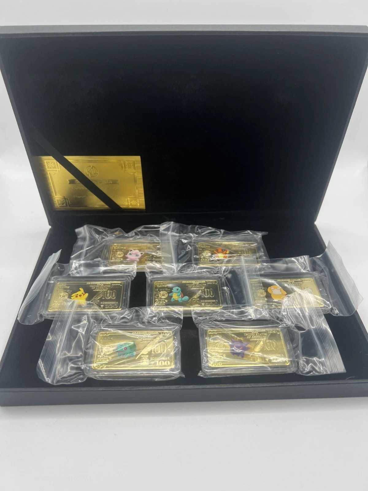 Juego de barras Pokemon 7 piezas dólar dorado chapado en oro con estuche