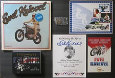 EVEL KNIEVEL LOT!!  BOOK, FUNERAL PROGRAM, 1974 SEALED LP, and 1972 BRONZE COIN