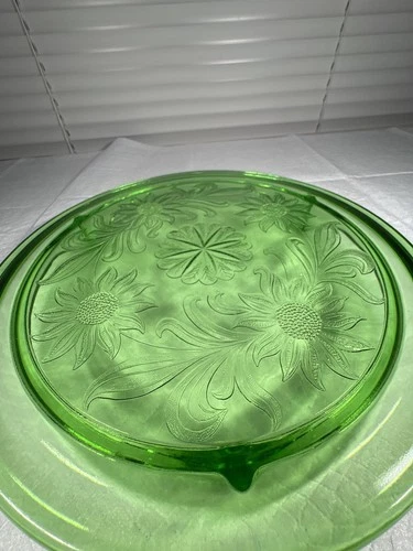 Uranium green depression glass 3 footed cake plate by Jeanette Sunflower pattern