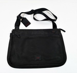 tumi slim messenger bag