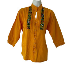 Typical Mexican blouse with hand embroidery, made by artisan women dron Oaxaca.