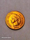 1876 Indian head penny. This coin as been cleaned at one time.