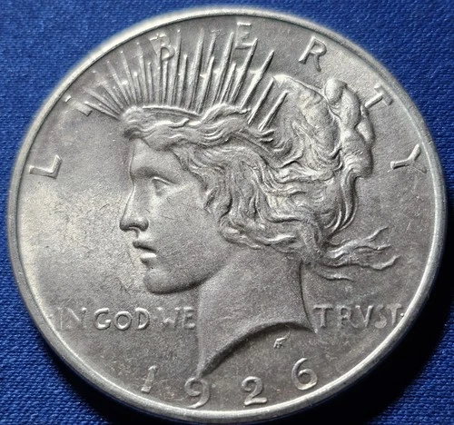 A 1926-D Peace Dollar 90% Silver $1 Dollar.  Nice High Grade BU
