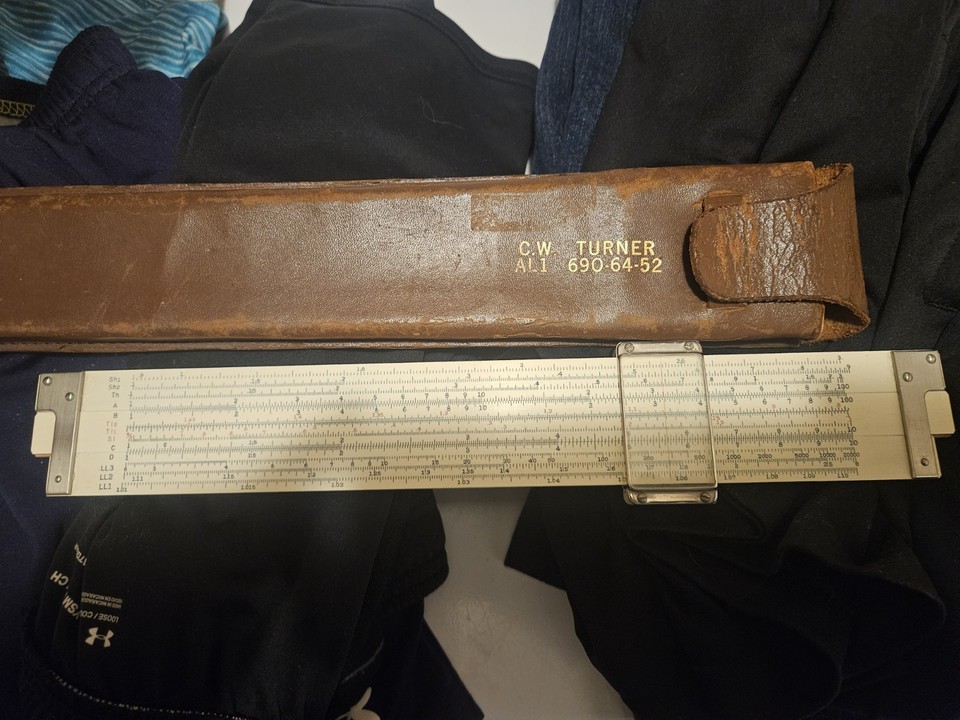 A Japanese Hemmi bamboo slide rule with a company logo — sustainably made from bamboo before sustainability was cool, and a genuine piece of mid-century corporate Americana.