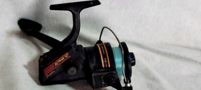 Shakespeare Alpha XT 300 Graphite Spinning Fishing Reel, Long Cast