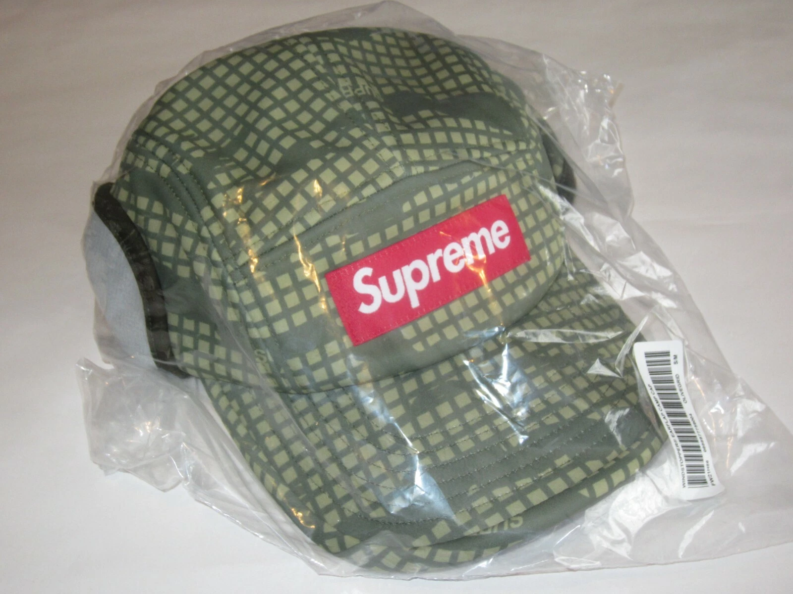 Casquette de camp SUPREME WINDSTOPPER Earflap OLIVE GRID CAMOUFLAGE chapeau petit/moyen NEUF ! F/W21