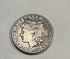 1884-S KEY DATE. RARE $1 Morgan Silver Dollar naturally toned
