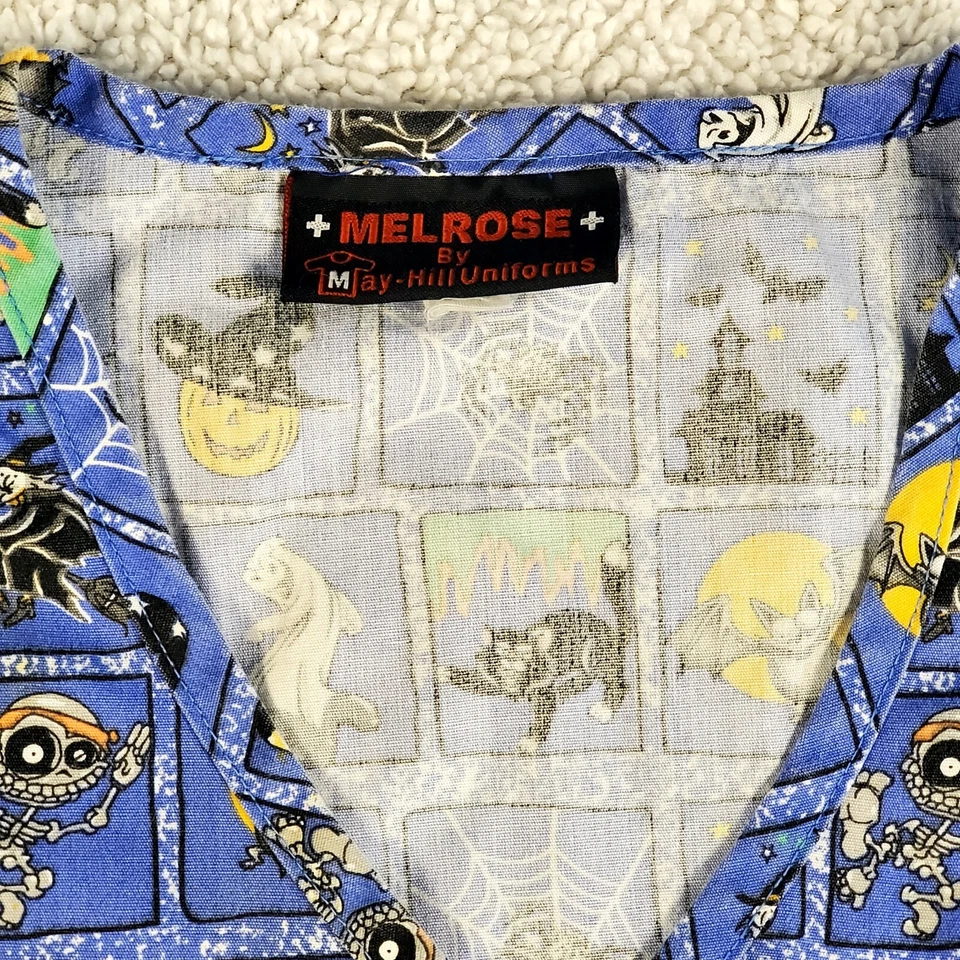 Melrose+ By May-Hill Uniform Blue/Black/Yellow Halloween Scrub Top (M) - Imagem 2 de 4