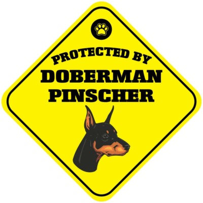 Yellow Aluminum Crossing Sign Protected by Doberman Pinscher Dog Cross Xing