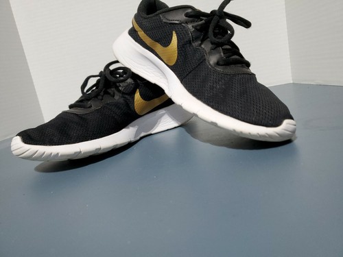 nike tanjun metallic gold