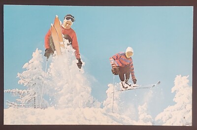 Two Guys Skiing and a Fast Jump long the Trail Unposted