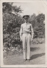 WW2 Photo of US Army Soldier Standing Beside Flower Bed in Yard