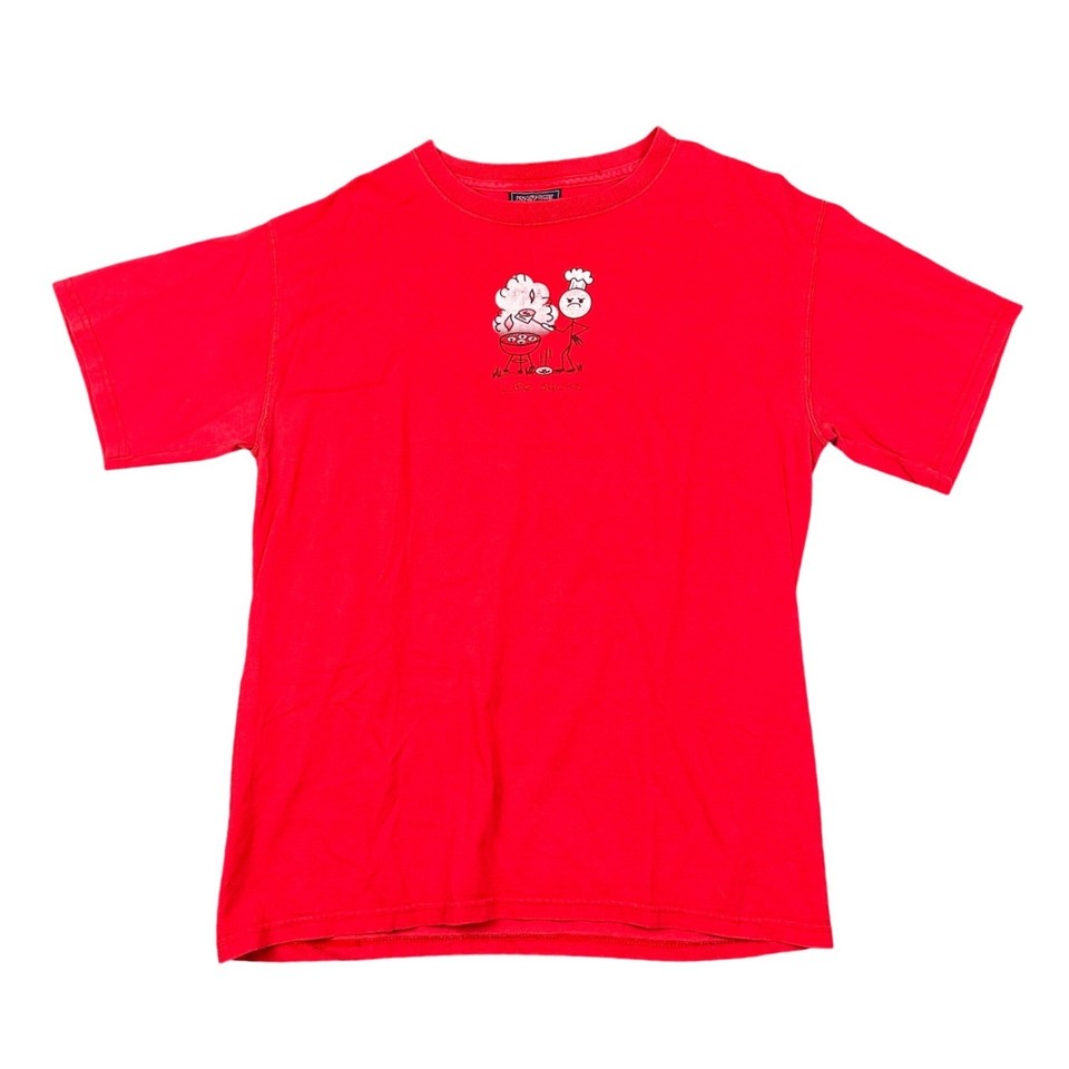 An actual vintage 90s JanSport tee with a 'Life Sucks BBQ' cartoon graphic — the kind of deadpan absurdist shirt you can't find new anywhere.