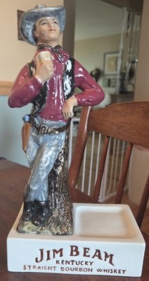 Vintage Jim Beam Kentucky Bourbon Whiskey Cowboy statue with area for bottle