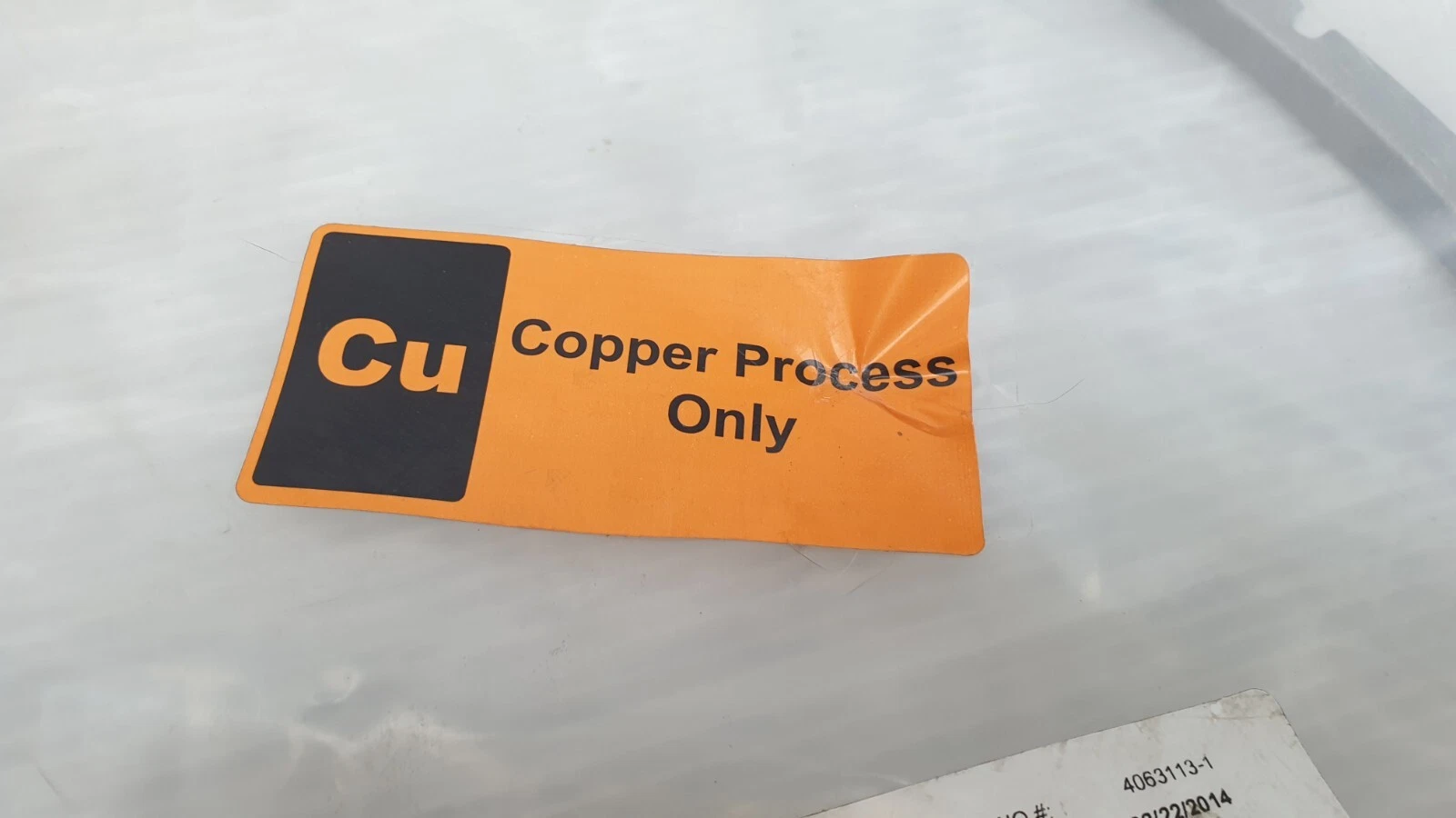 Orange Cu Copper Process Only sticker on the bag of the AMAT inner shield clamp
