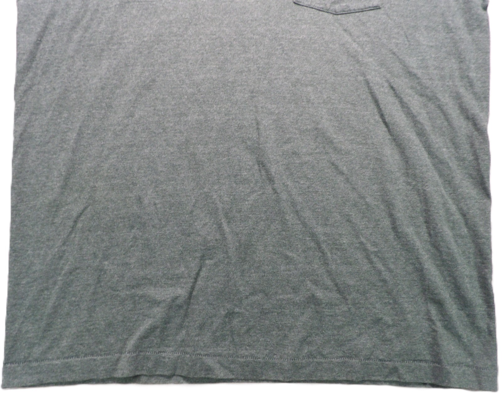 Gray VTG men’s shirt with single stitch, small pocket, and visible wrinkles on fabric.