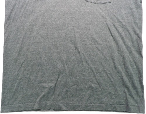 Gray VTG men’s shirt with single stitch, small pocket, and visible wrinkles on fabric.