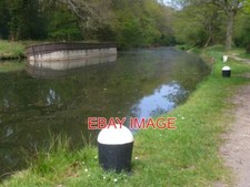 PHOTO  BARGES AND BOLLARDS TWO LISTING BARGES AND A PAIR OF MOORING BOLLARDS ON
