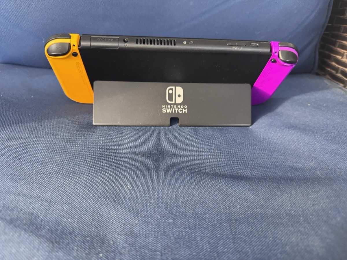 Nintendo Switch - OLED Model with original yellow -purple Joy-Cons