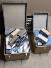 Over 40 slide trays, each holds 36 - 2 x 2 slides, most are in carry cases