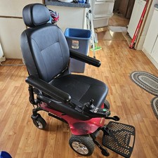 Candy Red Jazzy Select Elite ES power wheelchair with charger