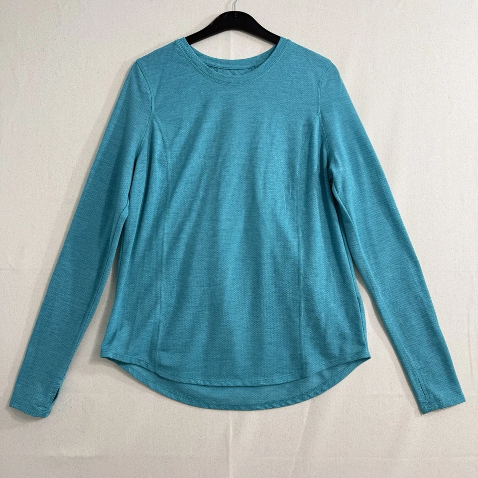 Camiseta de manga larga Avia Performance talla pequeña verde azulado plisada en la espalda agujeros para el pulgar Foto 2 de 4