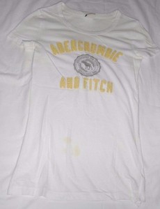 white t shirt with yellow writing