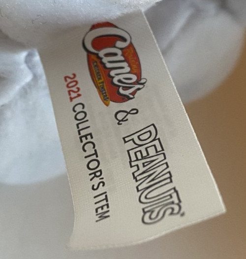 Raising Cane's Yellow Labrador dressed as snoopy Charlie brown Peanuts plush