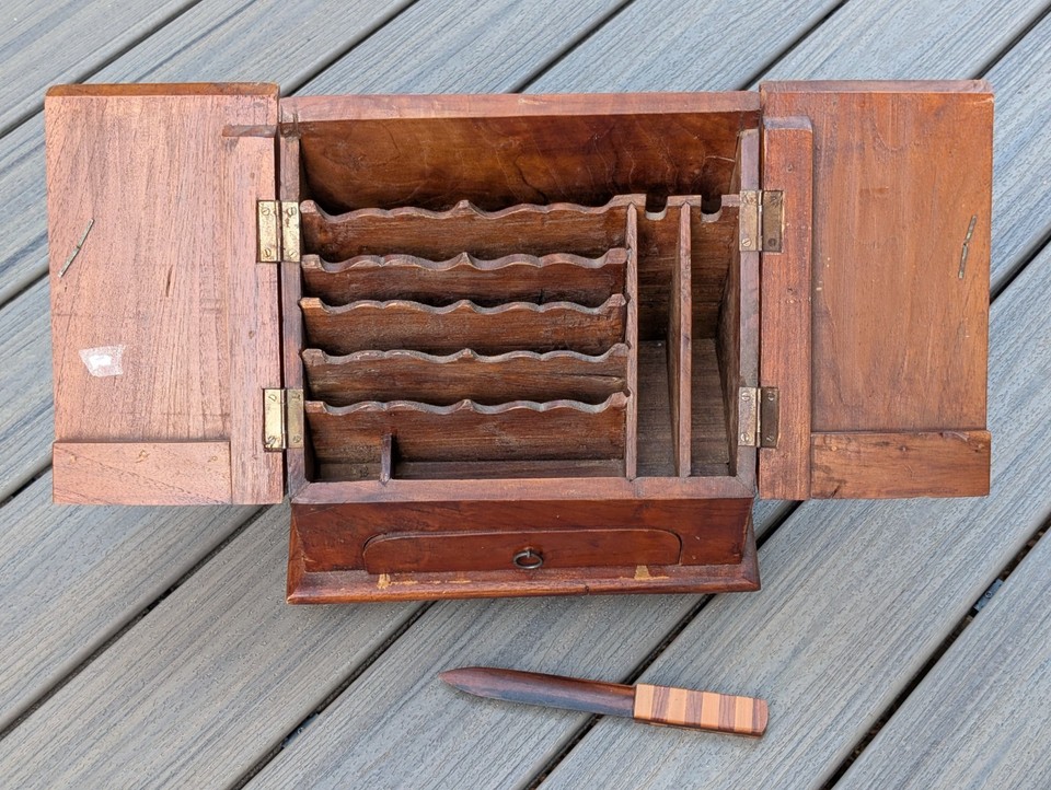 A proper antique stationery compendium with a hidden drawer — the kind of beautifully crafted letter-writing cabinet that makes you want to correspond by hand again.