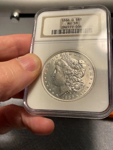 (#101548) Morgan Dollar: 1886 O -- NGC AU 58.  Old holder --  (see video)