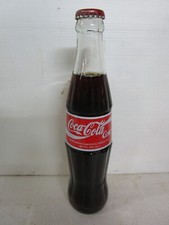indonesian coca cola bottle. 295ml glass ceramic labels ex condition.