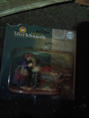 Santa's Workbench Collection Woman Selling Flowers Porcelain Figurine