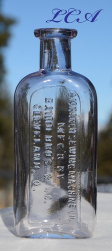 Antike MONARCH NÄHMASCHINENÖL Flasche BAIRD BROS Co CLEVELAND OHIO geprägt - Bild 1 von 5