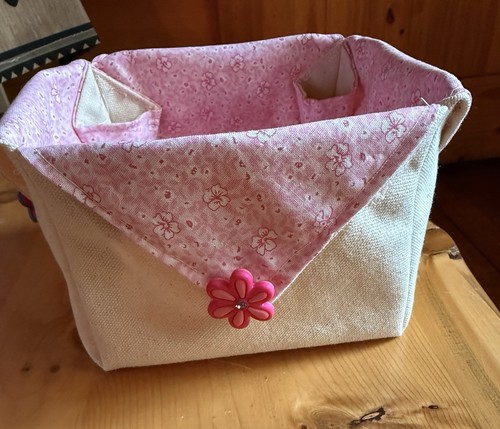 Handmade fabric basket for girls room. Beautiful pastel floral pattern.