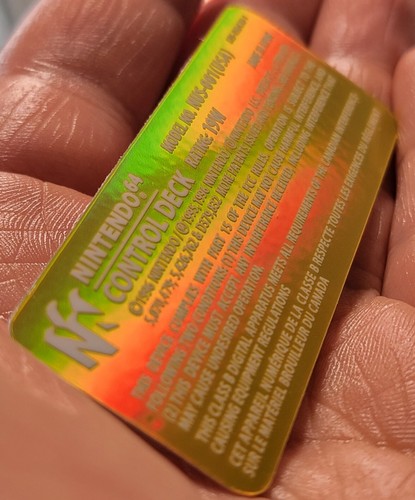 1 NINTENDO 64 N64 CONTROL DECK NUS-001(USA) GOLD🏷 HOLO WHITE TEXT LABEL STICKER - Picture 6 of 18