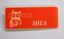 SHEA - HOOTERS RESTAURANT ORANGE NAME TAG W/ WHITE LETTERS (PIN) SHEA