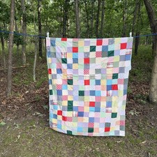 HAND TIED PATCHWORK SQUARES QUILT. 79 X 51
