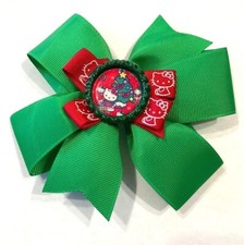 Beautiful Christmas Cat beside a Christmas Tree inspired hair bow for girls.
