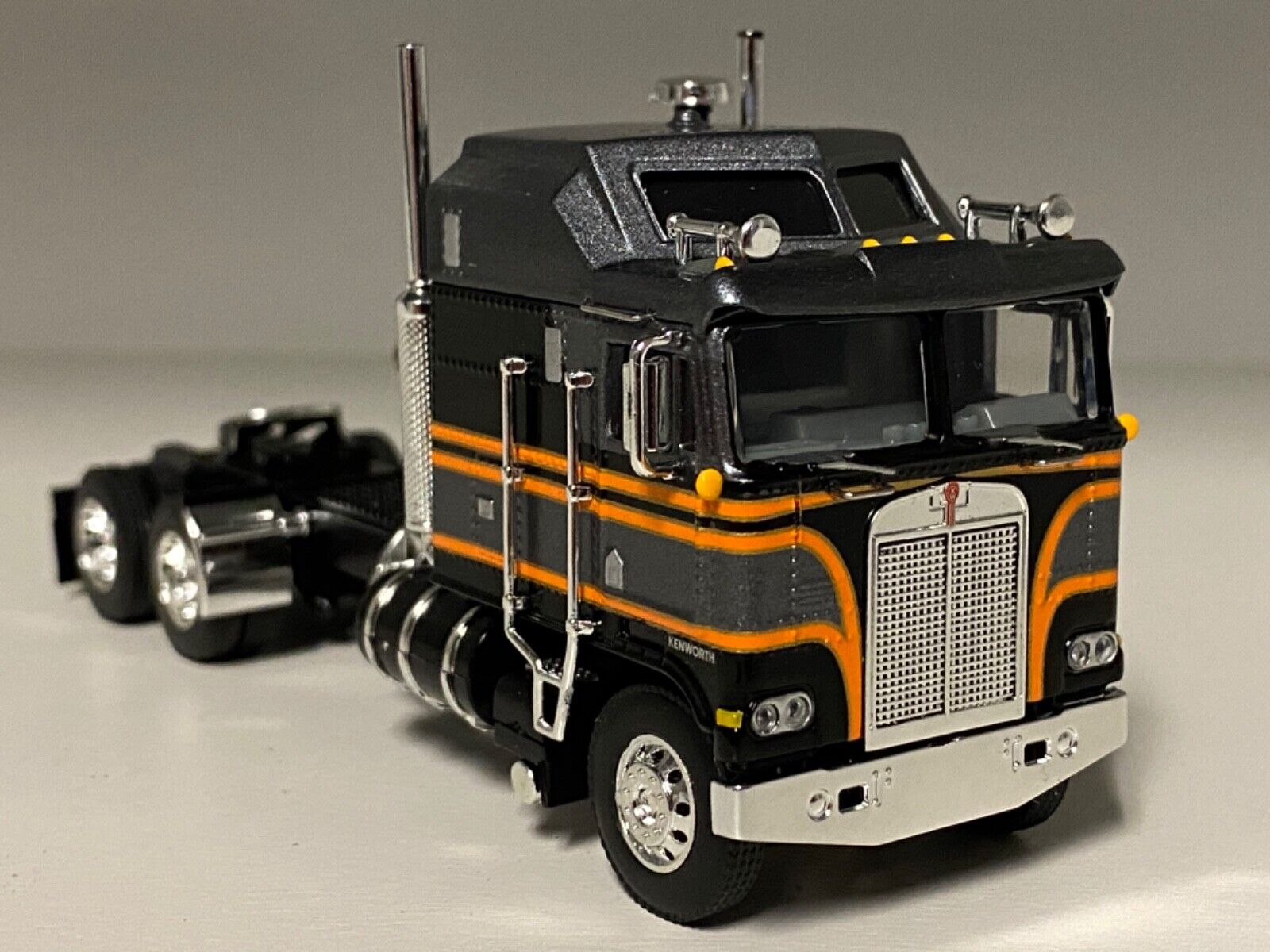 DCP 1/64 SILVER BLACK ORANGE KENWORTH K100 AERODYNE LONG FRAME