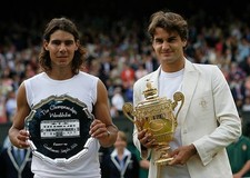 Roger Federer of Switzerland holds the trophy after winning the me- Old Photo
