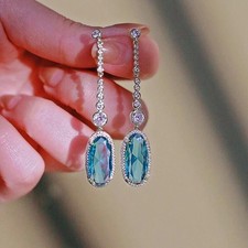 4Ct Oval Cut Lab-Created Blue Topaz Drop/Dangle Earrings 14K White Gold Plated