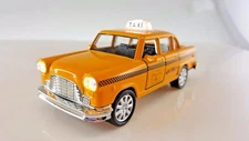 Yellow classic taxi with *Bright light & Sound* New York City Die Cast Metal car