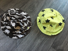 2 childs bucket hats, age 1-2 years by next one dinosaur one stars