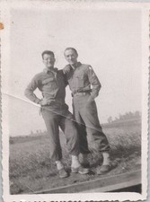 WW2 Photo of Two Soldiers Walking Arm in Arm on Road December 1944