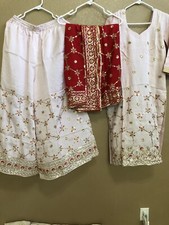 Indian Punjabi party wear pink and red stitched sharara suit