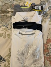 lot of boys under armour shirts and DSG Size large