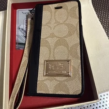 Coach Leatherware phone wallet case. iPhone 6 It is a folio-style case with card