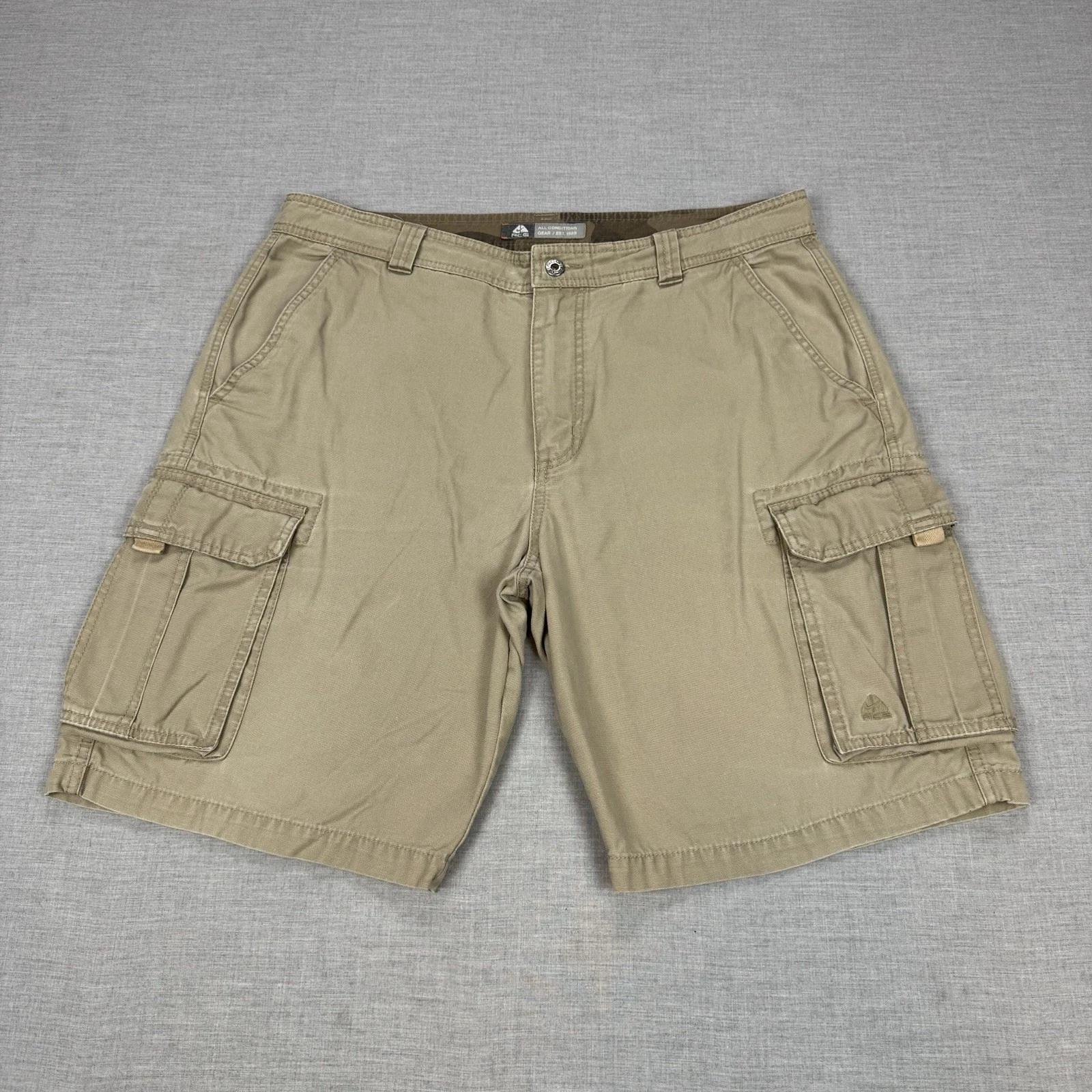 Pantaloncini Nike ACG uomo 36 tela marrone tasche cargo larghi escursionismo outdoor cuciture interne 10"