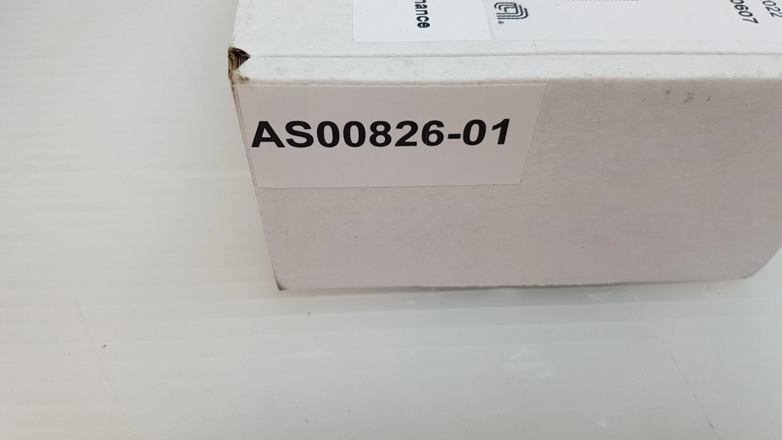 End of the Applied Materials box with a white label reading AS00826-01
